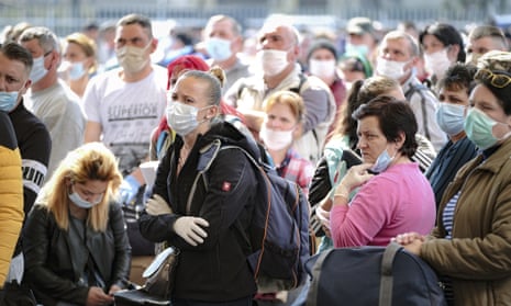 Seasonal workers wait to board flights to Germany in Cluj, Romania, 9 April 2020