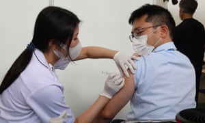 A man receives a jab of COVID-19 vaccine at the Tokyo Metropolitan Government office in Tokyo, Japan.
