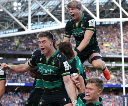 Henry Pollock (R) of Northampton Saints celebrates with teammates after their victory