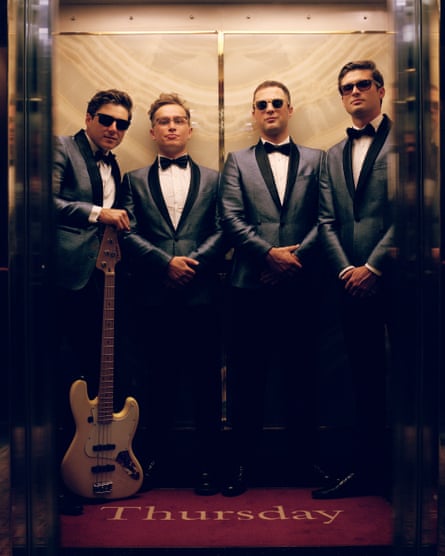 Adam Langstaff (second right), with onboard covers band the Runaround Kids.