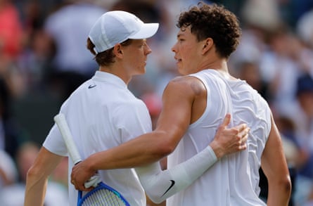Jannik Sinner (left) embraces Ben Shelton astatine nan nett aft his triumph successful their Wimbledon quarter-final.