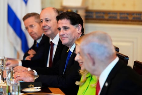 Israel's Prime Minister Benjamin Netanyahu, from right, attends a meeting as Netanyahu's wife Sara Netanyahu, Israel's Strategic Affairs Minister Ron Dermer, Israel's National Security Adviser Tzachi Hanegbi and Israel's Cabinet Secretary Yossi Fuchs listen in the Blue Room of the White House.