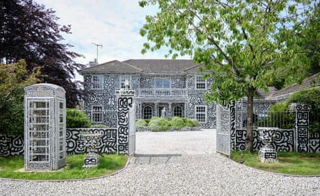 The exterior of the black and white doodled house of Mr Doodle, aka the artist Sam Cox