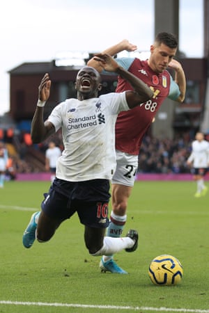 Sadio Mané of Liverpool goes down under a challenge from Frédéric Guilbert.