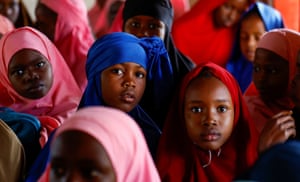 A group of girls, two girls look into the camera