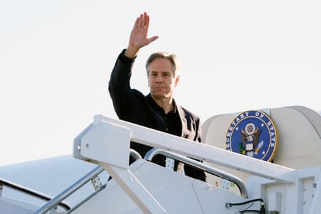 Antony Blinken waves as he boards his plane at Andrews airbase in Maryland on his way to Beijing for his three-day visit to China