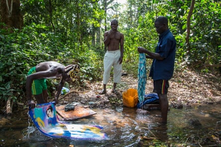 Sunday is wash-day. Chinko workers head down to the forest near the reserve’s main camp to chill in the shade, listen to music and wash their clothes and other belongings in a stream.