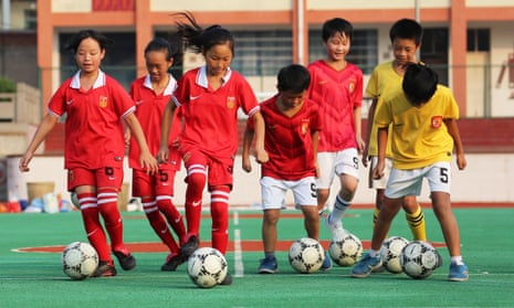 Pupils of the Anbing Primary School take part in a football training in Yongxing Town of Huaying City, Sichuan Province.