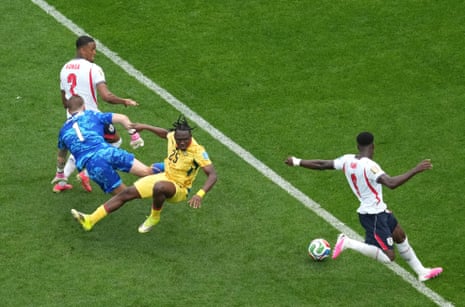 Ghana's Prince Adu collides with England goalkeeper Jordan Pickford.