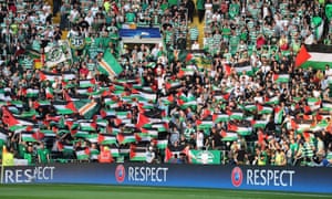 Palestinian flags are waved by fans during the first leg of the playoff between Celtic and Hapoel Be’er-Sheva in Glasgow last week.