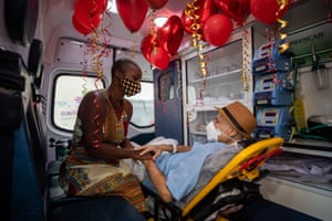 Bruno de Nicola and Eunice Cides de Oliveira wait for their wedding ceremony inside an ambulance in Rio de Janeiro