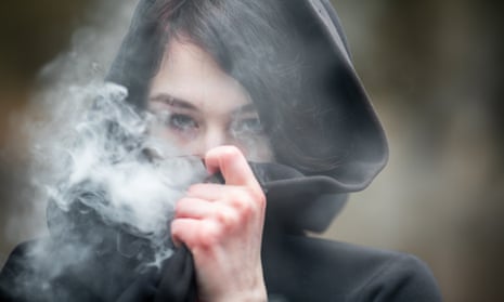 teenager smoking a vape