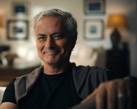 José Mourinho smiles while sitting in his home