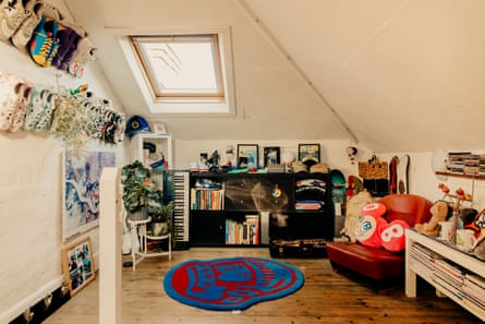 Aimee’s loft bedroom – filled with colourful pieces and rows of trainers on the wall – at their family home
