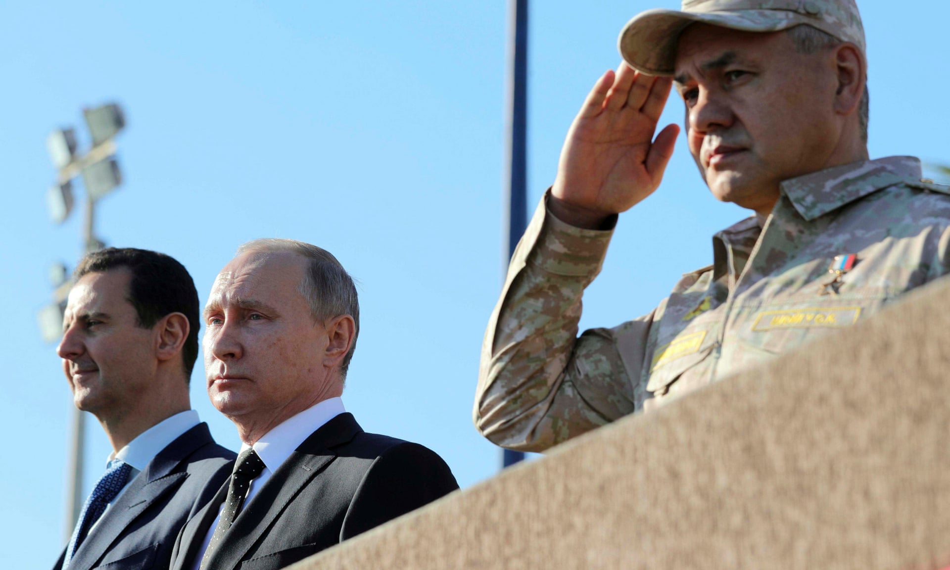 Syrian president Bashar al-Assad(left), Russian president Vladimir Putin (centre) and defence minister Sergei Shoigu visit the Hmeymim airbase in Latakia province. Photograph: SPUTNIK/Reuters