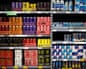 Energy drink cans on display on a supermarket aisle