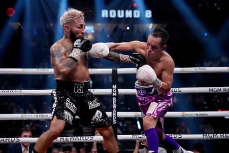 Alexandro Santiago, left, trades punches with Nonito Donaire during the eighth round of their fight on Saturday for the vacant WBC bantamweight title.