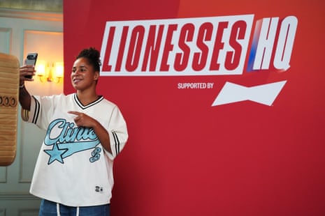 Demi Stokes takes a selfie in front of the Lionesses HQ sign