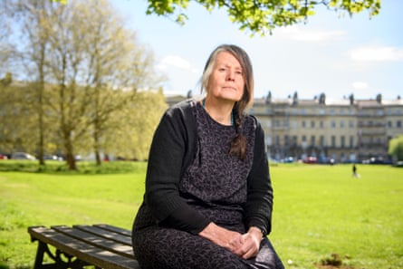 Davina Ware sits on park bench in the sun in Bath