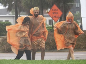 Pedestrians brave the conditions on International Drive in Orlando