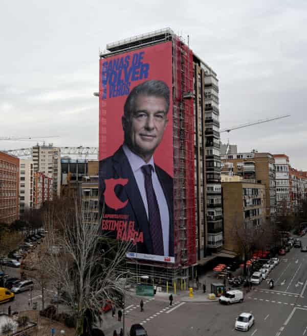 The giant electoral poster of Joan Laporta is displayed on a building next to the Santiago Bernabeu in Madrid.