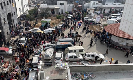 Displaced Palestinians gather in the yard of al-Shifa hospital, Gaza City, in December
