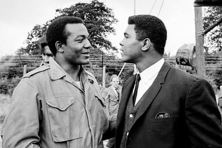 Muhammad Ali, right, visits Cleveland Browns running back and actor Jim Brown on the film set of The Dirty Dozen at Morkyate, Bedfordshire, England.