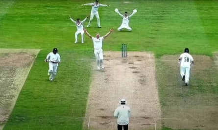 Liam Norwell and his Warwickshire teammates celebrate his ninth wicket