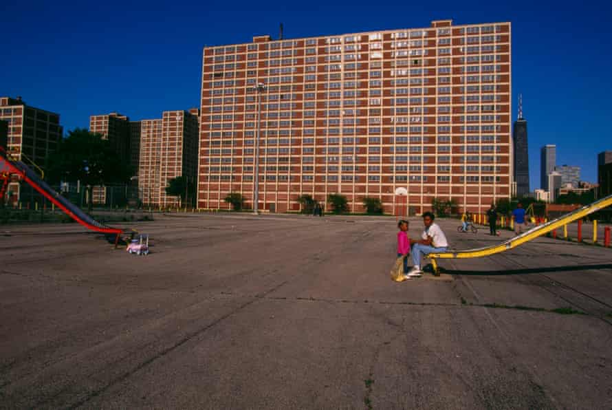 Children play on slides outside the Cabrini-Green housing project in Chicago.