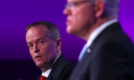 Bill Shorten looks at Scott Morrison during the leaders’ final election debate in Canberra.