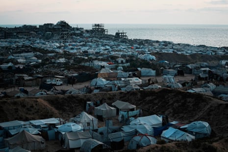 Displaced Palestinians living in makeshift tent camps in Gaza after months of Israeli bombardment.