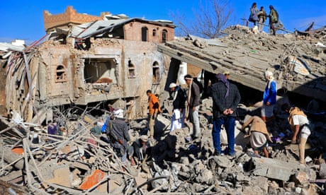 people look at destroyed building