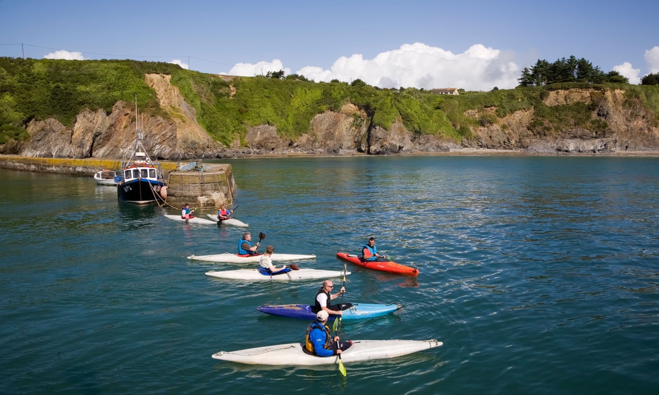 Kayaks in the harbour at Boatstrand, Copper Coast, County Waterford.