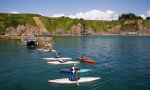 Kayaks in the harbour at Boatstrand, Copper Coast, County Waterford.