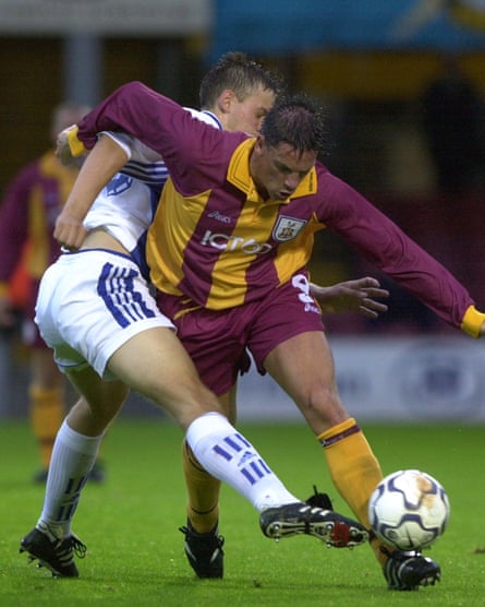 Bradford’s Lee Mills holds off St Petersburg’s Igor Nedorezov.