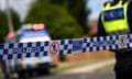 Victoria police tape restricts access to a crime scene.