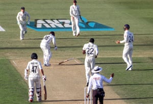 Henry Nicholls drops his bat after being hit by a delivery from Jofra Archer during the evening session.