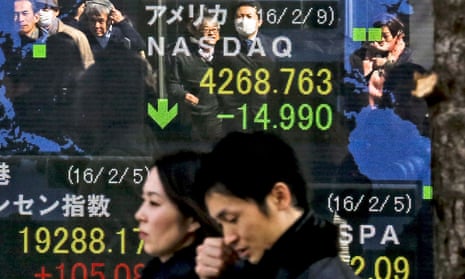 A ticker shows Japanese stocks taking another nosedive on Wednesday, falling below the 16,000 line to a roughly 15-month intraday low.