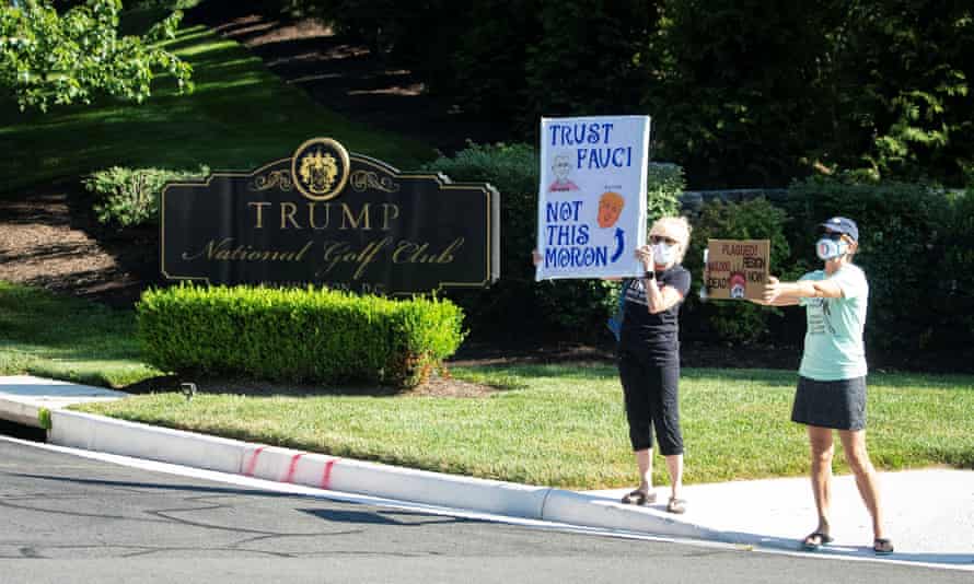 Demonstrators gather outside Trump National Golf Club on Saturday in Sterling, Virginia.
