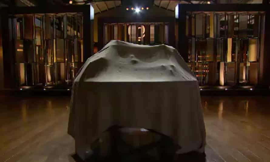 a table covered by a black sheet