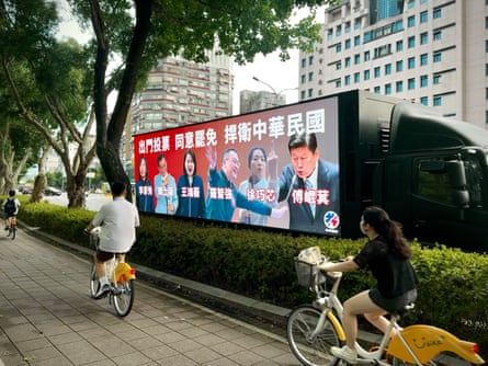 A truck carrying LCD screens parked in central Taipei urges people to vote to expel opposition legislators.