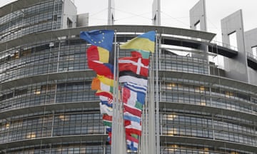 European flags fly outside the European Parliament in Strasbourg where an employee’s office was raided.