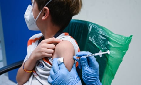 child being vaccinated in Spain