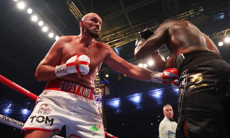 Tyson Fury lands a body blow on his opponent, Dillian Whyte.