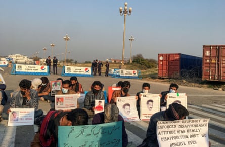 People seek details about the whereabouts of missing family members at a protest in Islamabad