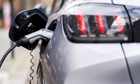 An electric car plugged into a Source London EV charging point in the capital