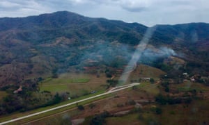 Smoke rises from the site of the plane crash in Punta Islita, Guanacaste, Costa Rica.