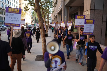 people hold signs outside