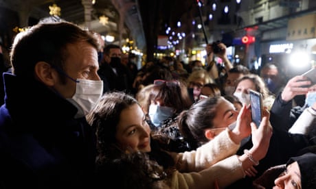 Woman taking selfie with Macron
