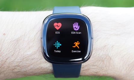 Fitbit Sense on wrist showing apps